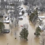 Frigid cold is moving across the US, including areas still recovering from deadly flooding