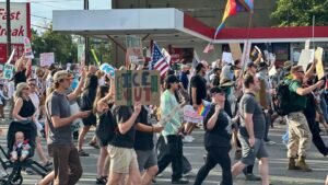 A fashion designer and father of 2 was killed at a ‘No Kings’ protest in Utah. 1 man is accused of murder – but he wasn’t the shooter