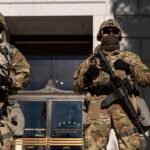California proposal to make it a misdemeanor for officers to cover their faces prompts federal criticism