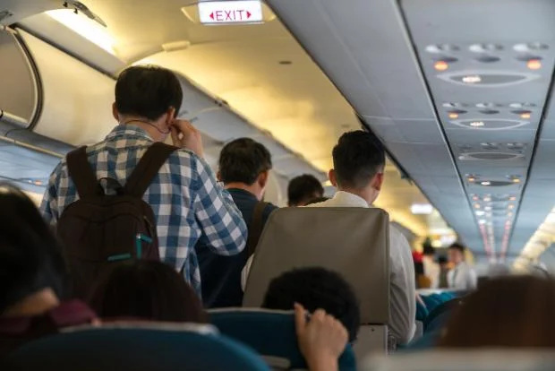 Stand up on the plane too early? You could be risking a fine