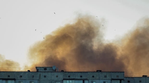 Ukraine says it struck a Russian air base as Moscow sent hundreds of drones into Kyiv